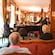 A singer and a pianist performing in a lounge full of Guests